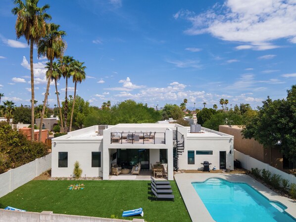 Private backyard with pool, rooftop deck, games, and plenty of space to relax