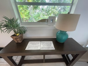 Side table near the front entrance with our general rules listed.