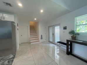 Main entrance to the building leading into kitchen and living room.