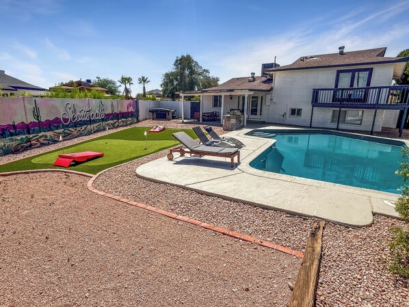 Swim, sunbathe, or snap pics—your desert paradise with a pool and mural awaits!