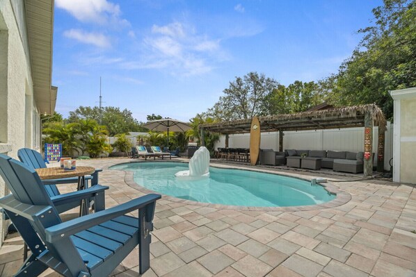 Enjoy the heated pool, fire pit, grill, cozy lounge area and plenty of outdoor games in your own tropical island paradise!