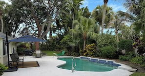 Enjoy lush landscaping by the pool side-majestic oak trees-sun-shade-decompress.