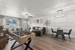 Living Room with Foosball & Seating 🎯 Challenge your travel mates to a foosball match in this chic lounge space.