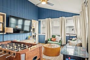 Level up your vacation with a game room featuring foosball, arcade games, and board games!