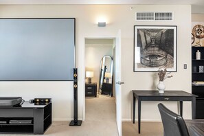 Enjoy a memorable stay in this stylish living space with its artful touches and home theater setup. A designed for both relaxation and entertainment. The focus is on the artful decor and home theater setup, creating a unique and engaging space for your stay.