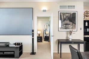 Enjoy a memorable stay in this stylish living space with its artful touches and home theater setup. A designed for both relaxation and entertainment. The focus is on the artful decor and home theater setup, creating a unique and engaging space for your stay.
