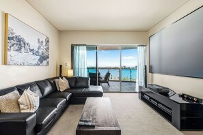 Step into this stylish, modern retreat and be captivated by the stunning panoramic water views that greet you from the expansive balcony. This chic apartment offers the perfect blend of comfort and elegance.