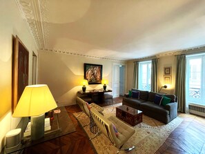 Living Room with view to street and Bedroom 3