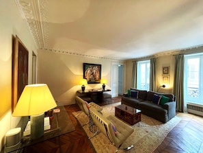 Living Room with view to street and Bedroom 3