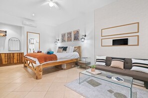 The primary suite has a comfy king bed, a sitting area with Smart TV and beautiful ensuite bathroom.