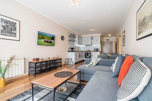 You’ll settle into this bright and airy space that blends comfort with function. Whether you’re streaming your favorite shows or catching up on emails, everything you need is right here — including a dedicated iron, ironing board, and clothes drying rack tucked away for convenience.