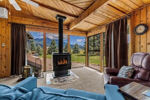 Cozy wood burning stove and views of the peaks!