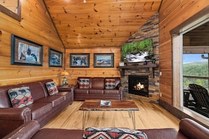 Living room with fireplace and big screen TV!