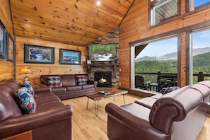 Living room with fireplace and big screen TV!