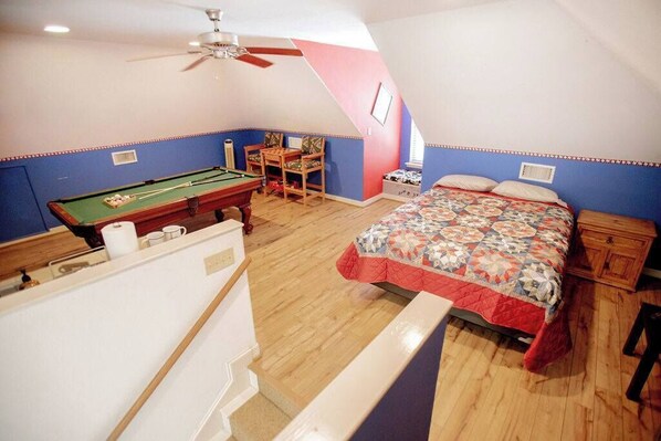 The studio apartment has a queen-sized bed, ample clothes & shoe storage and even your own private billiards table!