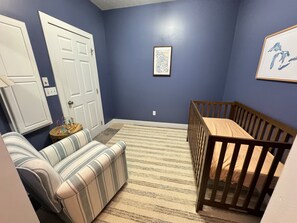 Tucked off the master bedroom, it’s the perfect setup for new parents to relax and stay close - complete with crib, rocking chair, sound machine & baby monitor.