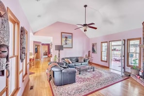 Living room facing sun room and front deck