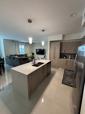 Open Concept floor plan connecting living room, kitchen, and dining room