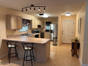 Kitchen with Keurig dual for pods and a pot of coffee.