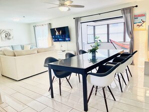 Open plan living room with 65" smart TV. 
