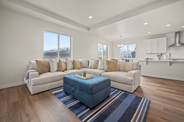Soak in the mountain views from the living room, framed by three sets of windows that flood the space with natural light.