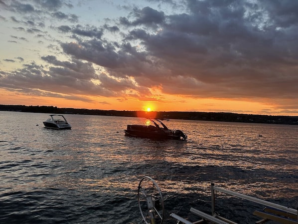 Beautiful sunset right from the beach complete with a private dock & lounge chairs