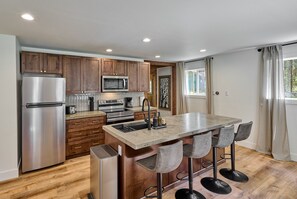 This kitchen's open design lets you cook while staying connected to the action