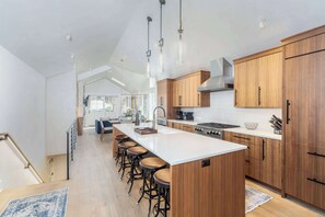 Kitchen: Upper floor, drip coffee maker, Keurig, toaster, cooking utensils, tableware