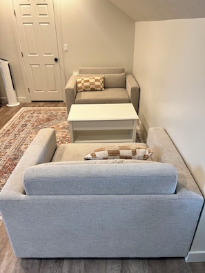 2 large chairs that fold out to double beds