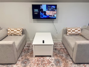 2 large chairs that fold out to double beds w/ SmartTV