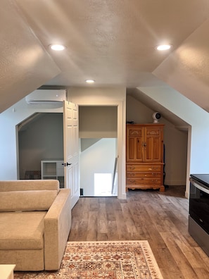 Spacious living room w/ 2 large chairs that fold out to double beds