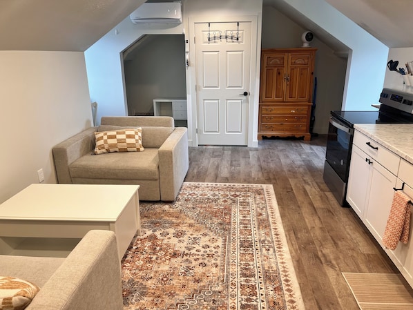 Spacious living room w/ 2 large chairs that fold out to double beds