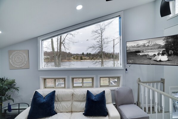 Enjoy stunning lake views right from the living room — the perfect backdrop for relaxing or movie nights.