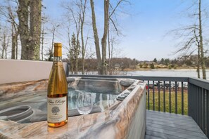Private hot tub with peaceful lake views — the perfect place to relax and unwind after a day of adventure.