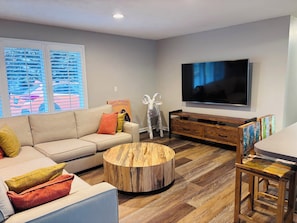 Living room with open concept kitchen and bar