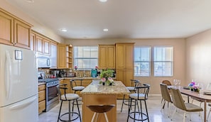Pull up a seat at the spacious center island for hearty meals & cozy gatherings