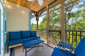 The screened in porch is the perfect spot for a morning coffee.
