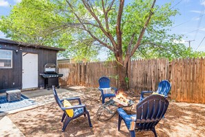 A bonfire area with seating for four