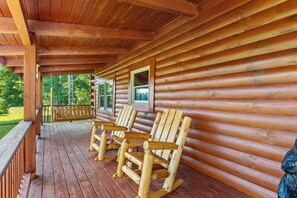 Enjoy mornings with your coffee in hand on the solid log porch swing!