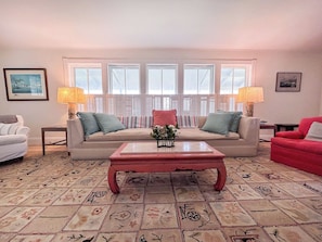 Spacious living room with views of the water