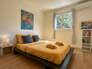 Bedroom 1, double bed, garden view