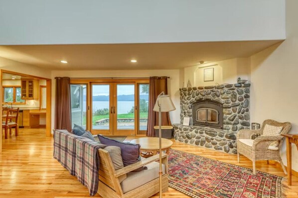 Cozy living room with wood heat and bay views