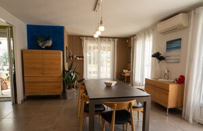 Air-conditioned dining room opening onto terrace