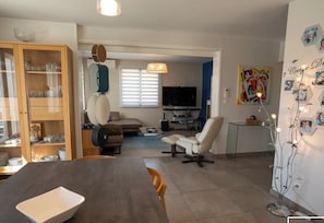 Large air-conditioned living room opening onto terrace