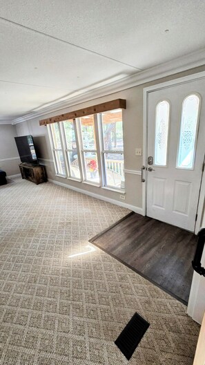 Front door on right, living room on left