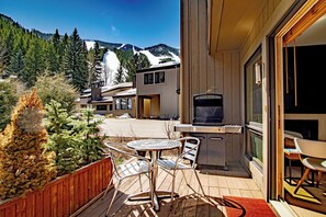 Sunny outside deck with ski views