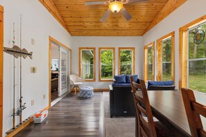 3 season porch with plenty of seating and games. Fishing poles are ready to use.