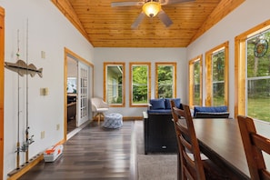 3 season porch with plenty of seating and games. Fishing poles are ready to use.