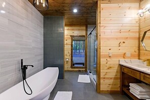 Luxurious bathroom with tiled wall and walk-in shower
