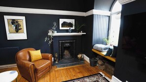 Fully functioning feature fireplace with cosy seating area